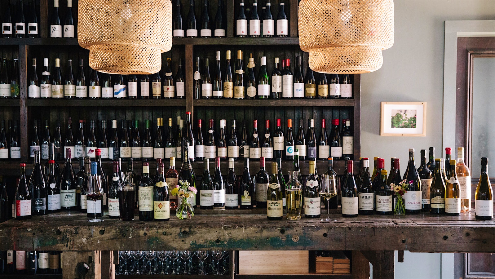 Shelves and a table filled with wine at Dedalus Wine Bar.
